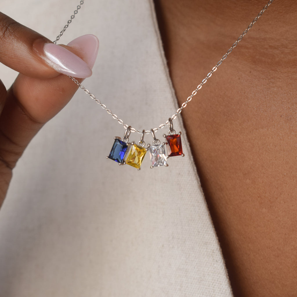 Family birthstone necklace with three personalized gemstone charms – custom sterling silver layered jewelry